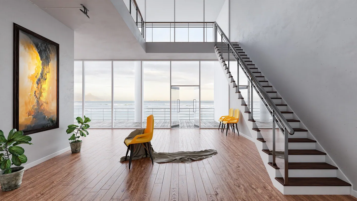 Intérieur moderne spacieux, escalier, vue océan, grand tableau abstrait.